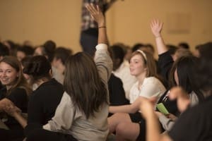 student raising hand