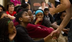 Student shaking hand with a youth frontiers retreat leader