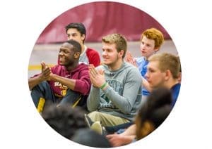 Group of students clapping on a Youth Frontiers retreat