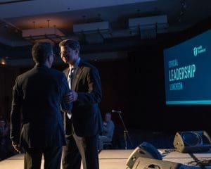 Joe Cavanaugh and Tim Welsh on stage at Youth Frontiers' Ethical Leadership Luncheon