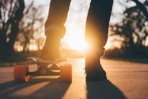 teenage fun — skateboarding at sunset