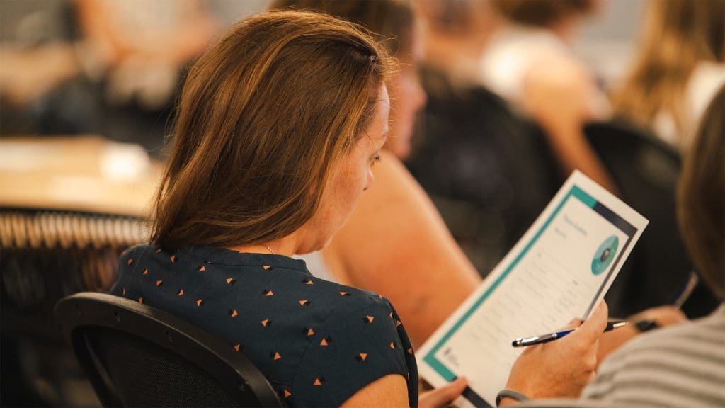 parent-academy-woman-participant-looking-at-worksheet